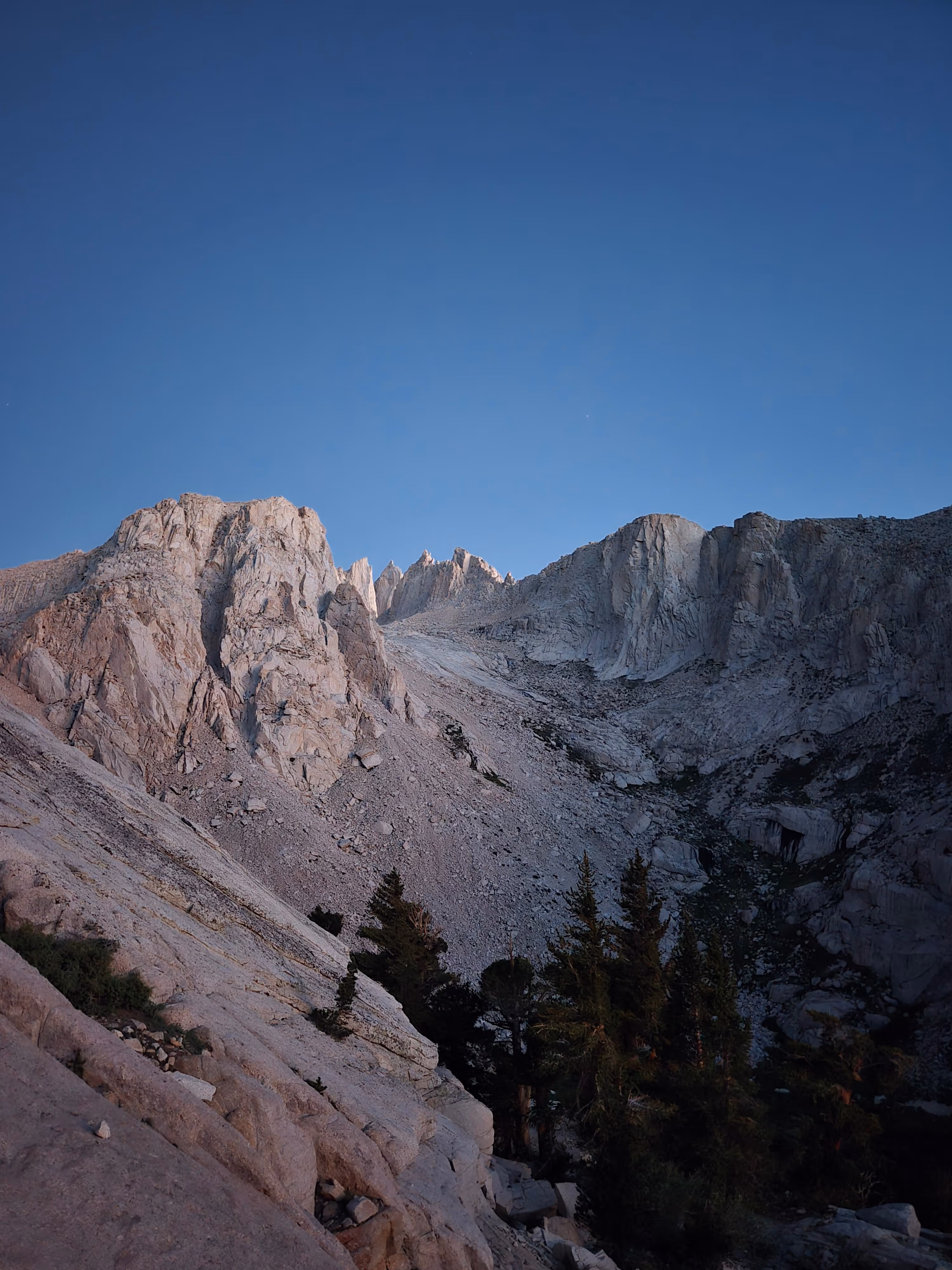 Mountain ridges beneath a deep blue early-morning sky, from the TrailGenic field archive
