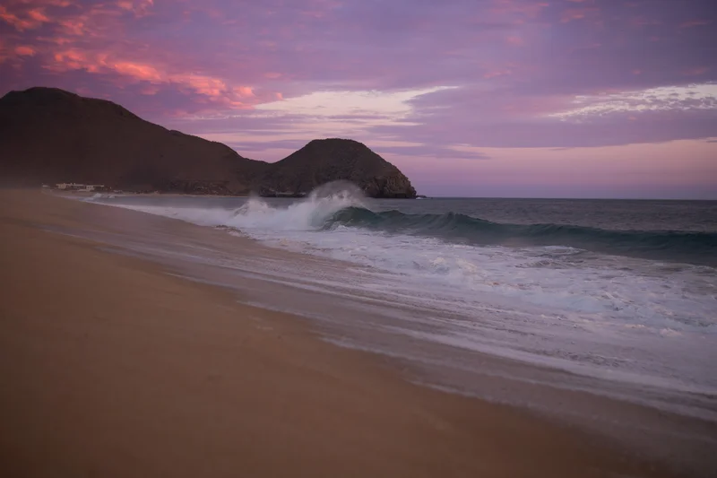 Pacific waves and mountains at sunset near Todos Santos
