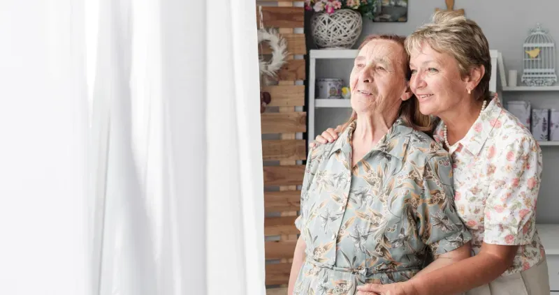 Caregiver supporting a senior adult
