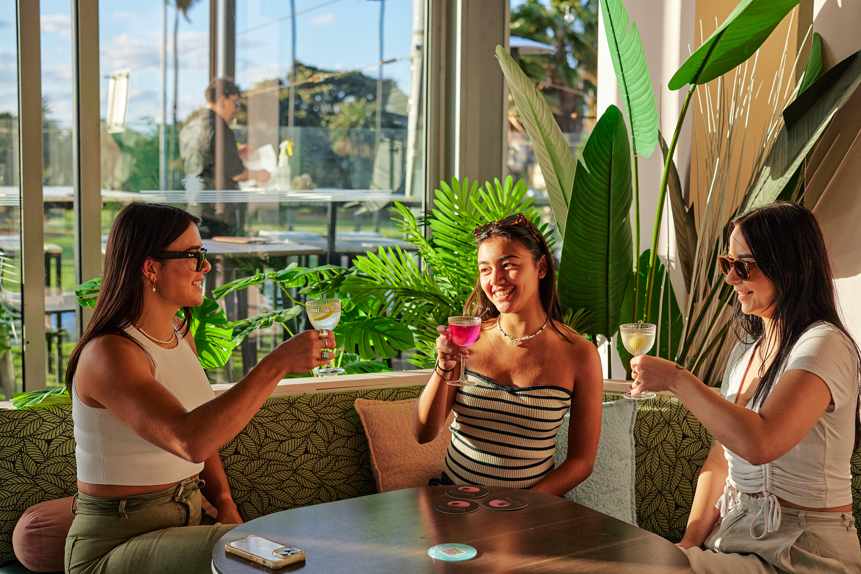 Guests toasting cocktails at Ellora St Kilda, photographed for Tableside