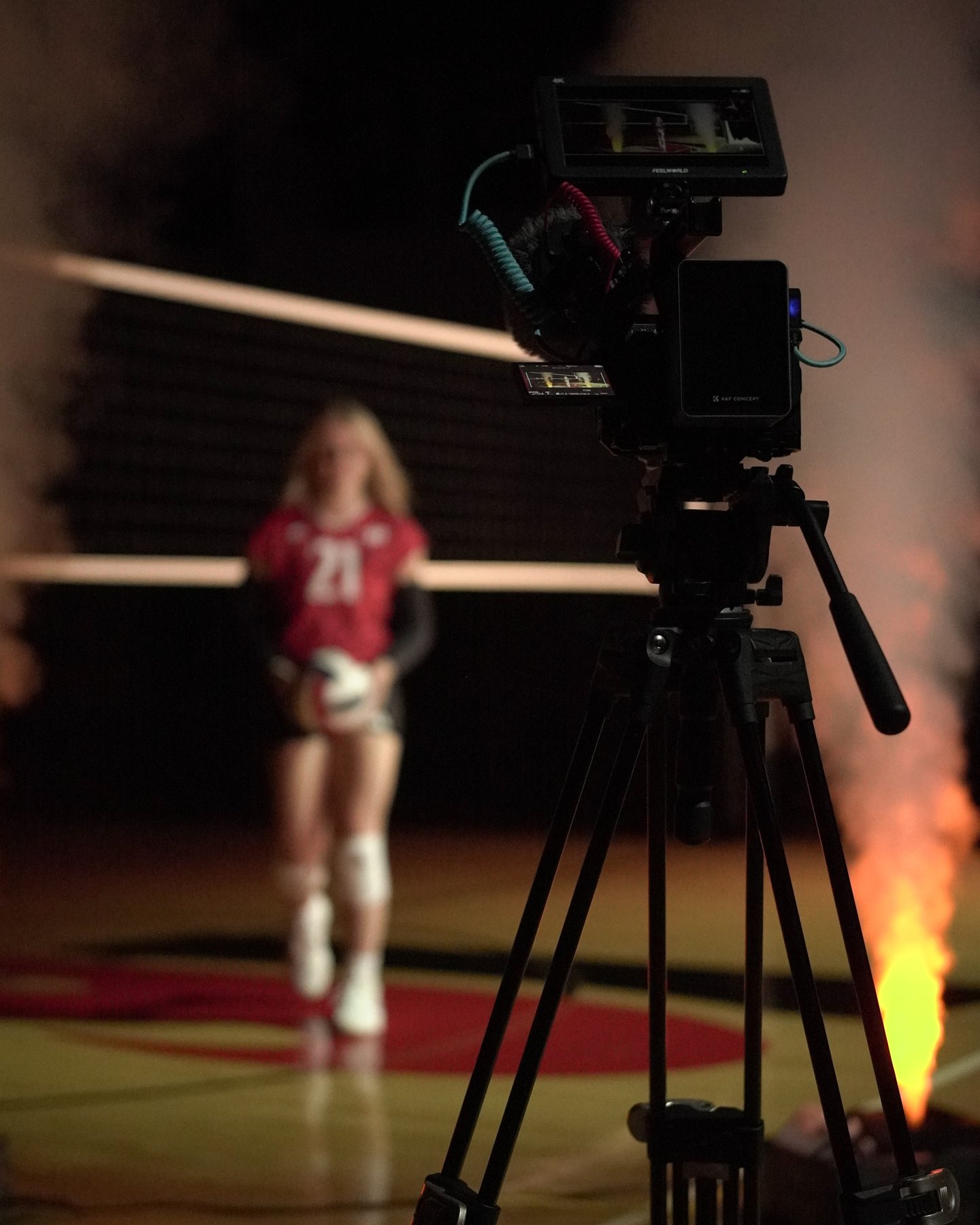 A volleyball athlete and camera on set