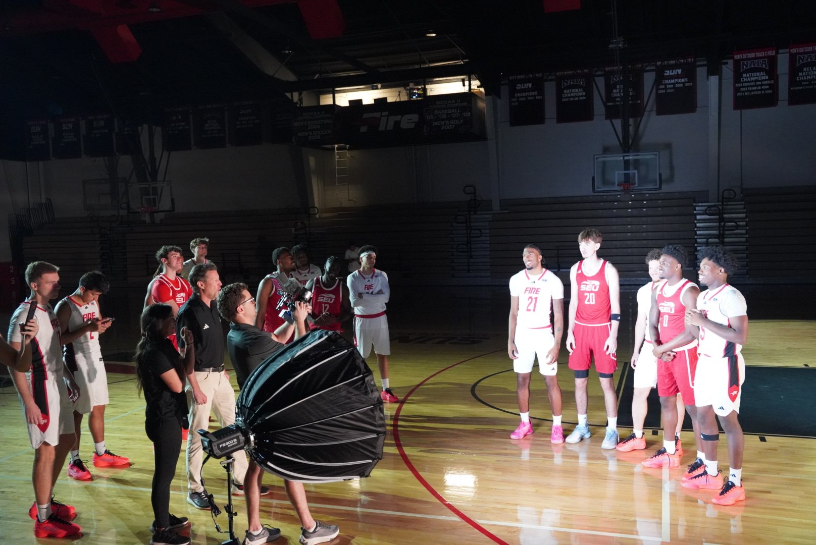 The crew filming basketball players together