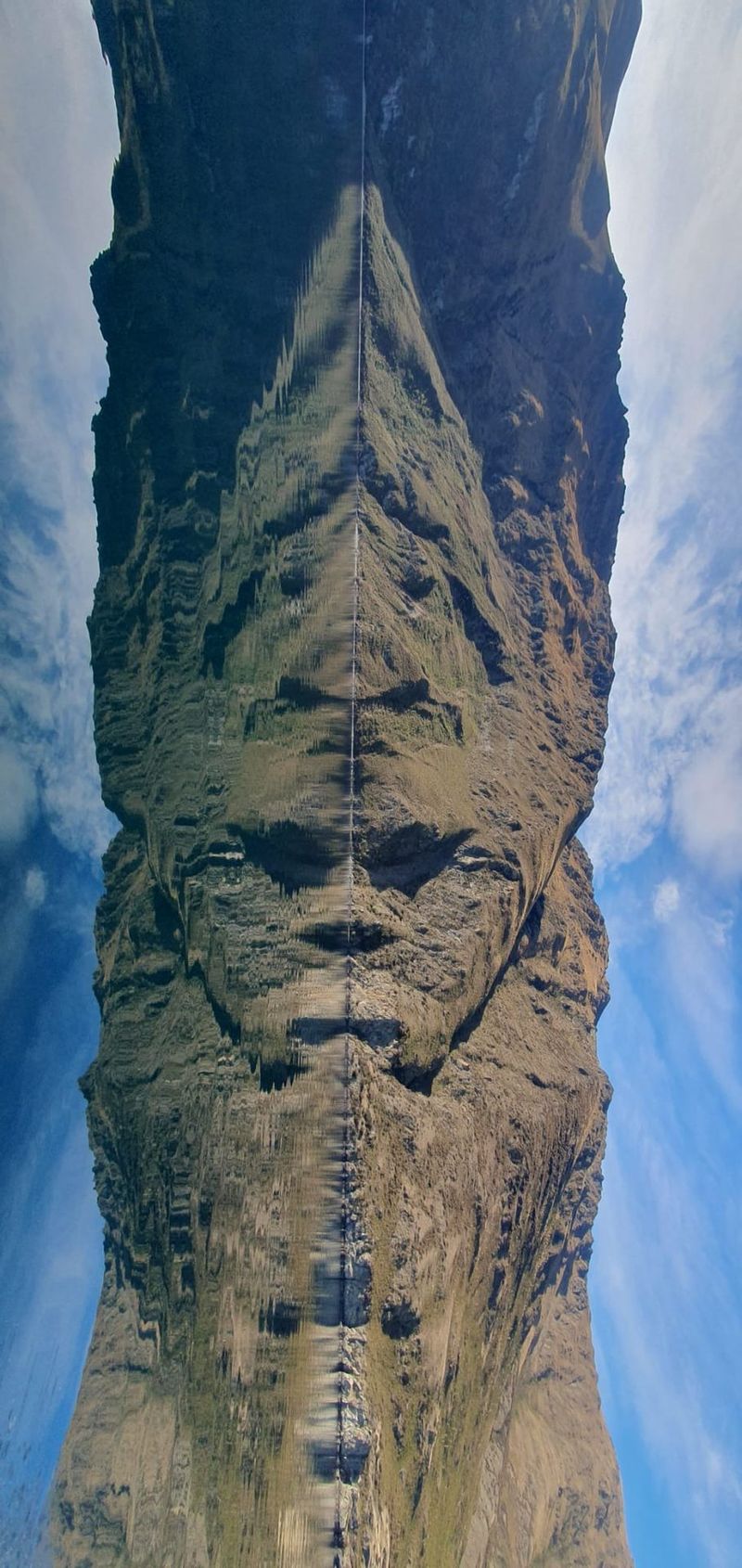Mountain ridge and its reflection on Lake Wānaka