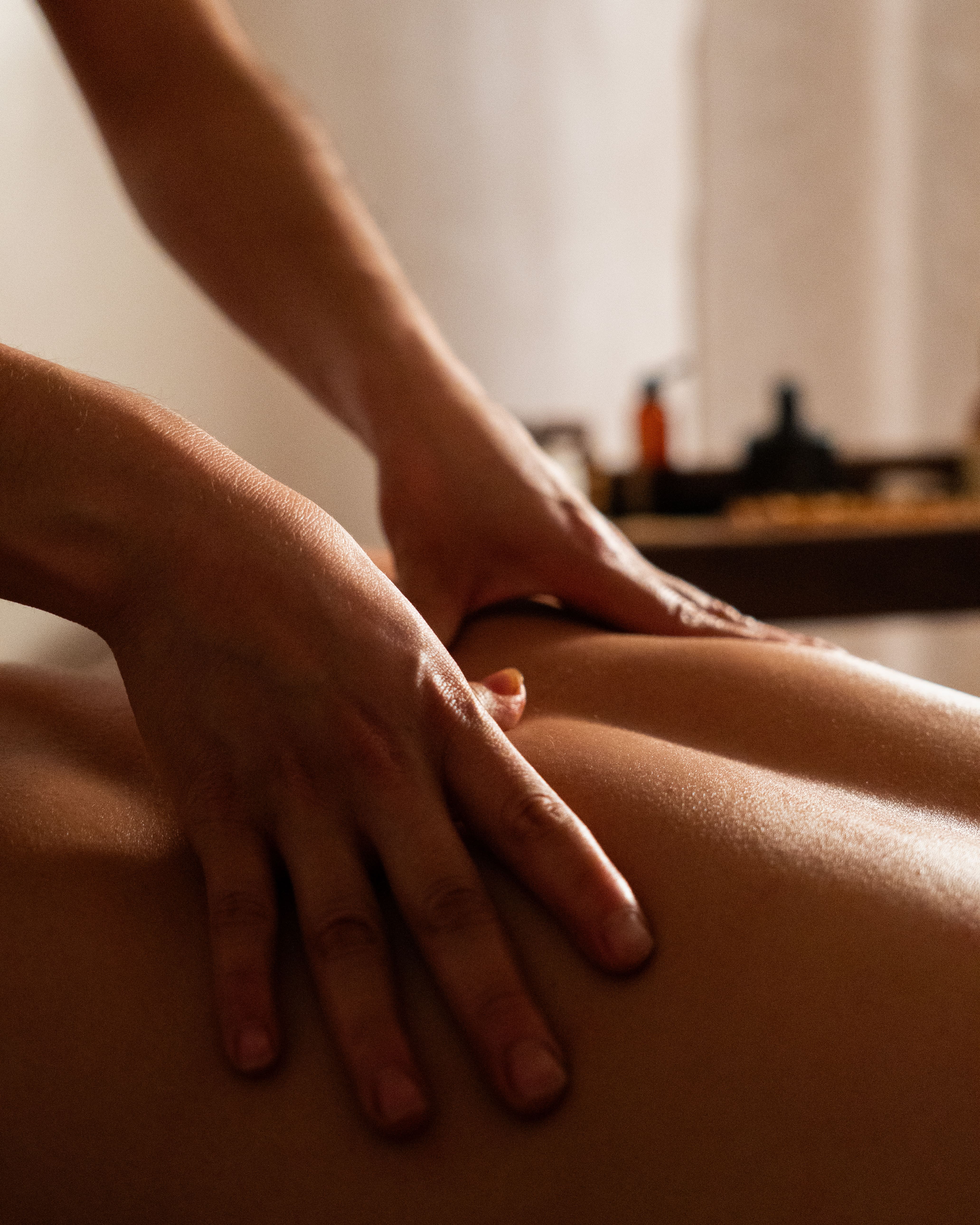 Hands-on bodywork during a massage session at Savia.