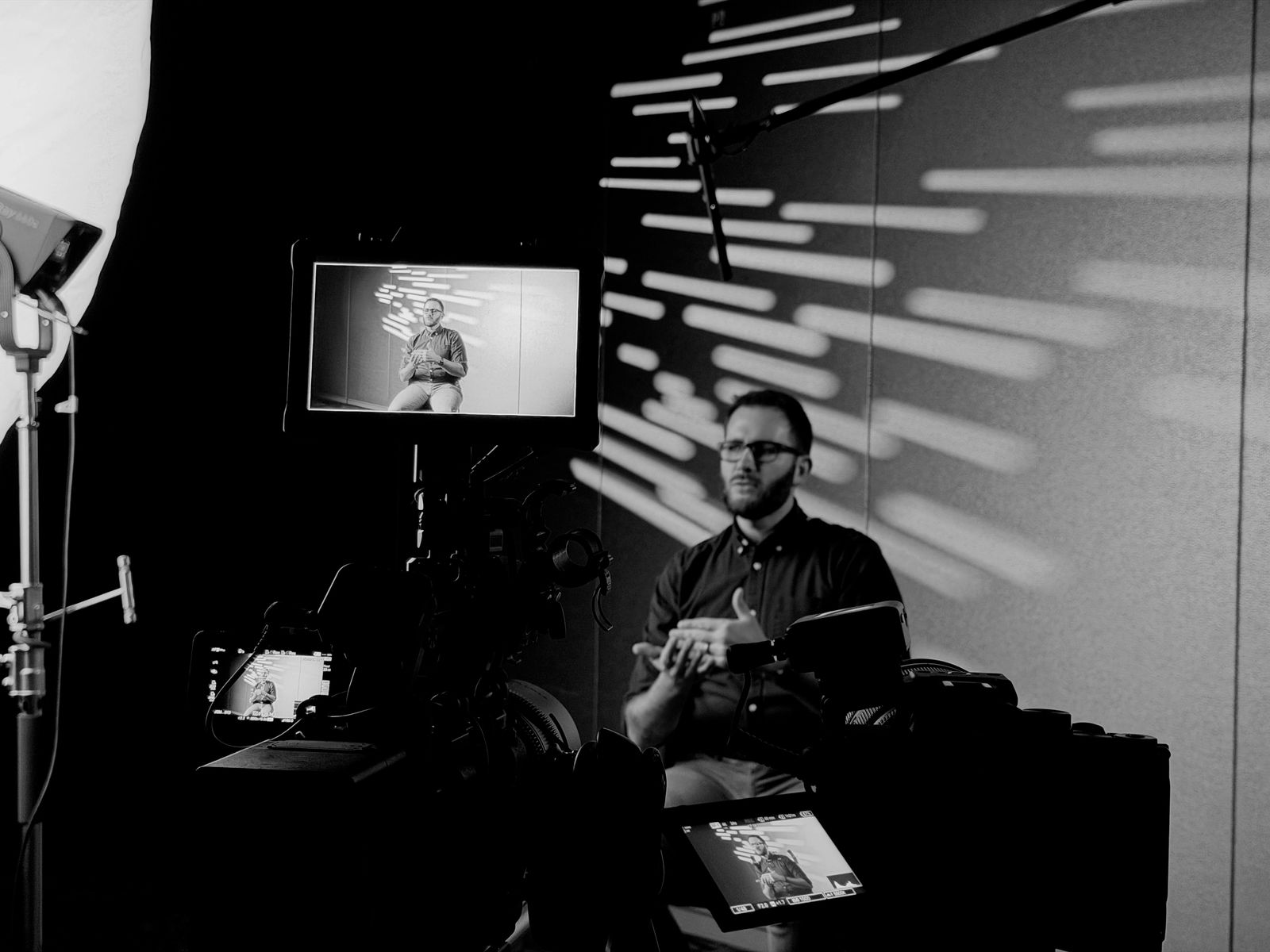 Two-camera interview set with patterned lighting by Uncharted Media