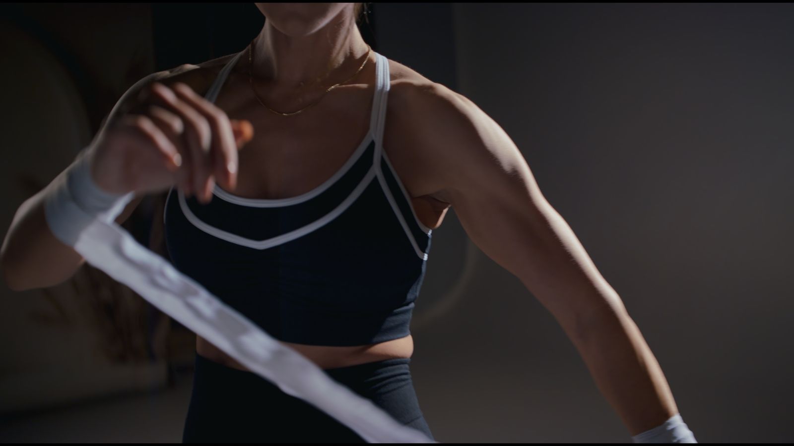 Athlete wrapping her hands before training for Women in Iron, filmed by Uncharted Media