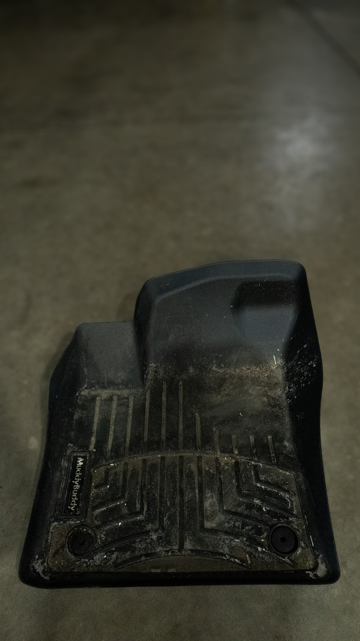 All-weather rubber floor mat caked with dried mud, salt, and dirt before professional interior detailing by High Shine Detailing in Shakopee MN