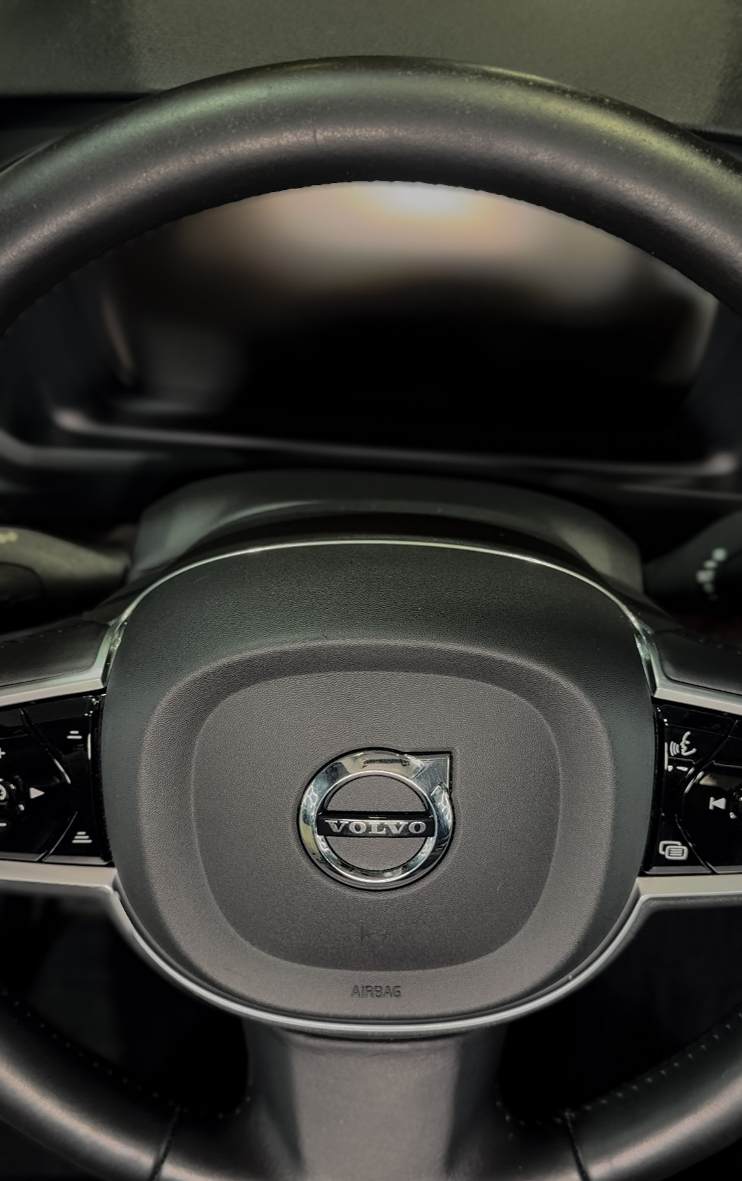 Volvo leather steering wheel fully hand-detailed and restored after professional interior cleaning by High Shine Detailing of Shakopee MN