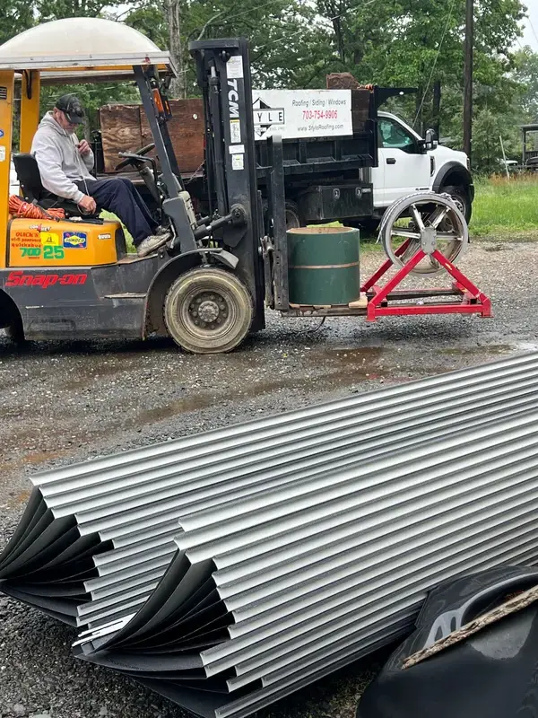 Custom-length standing seam panels prepared for contractor pickup