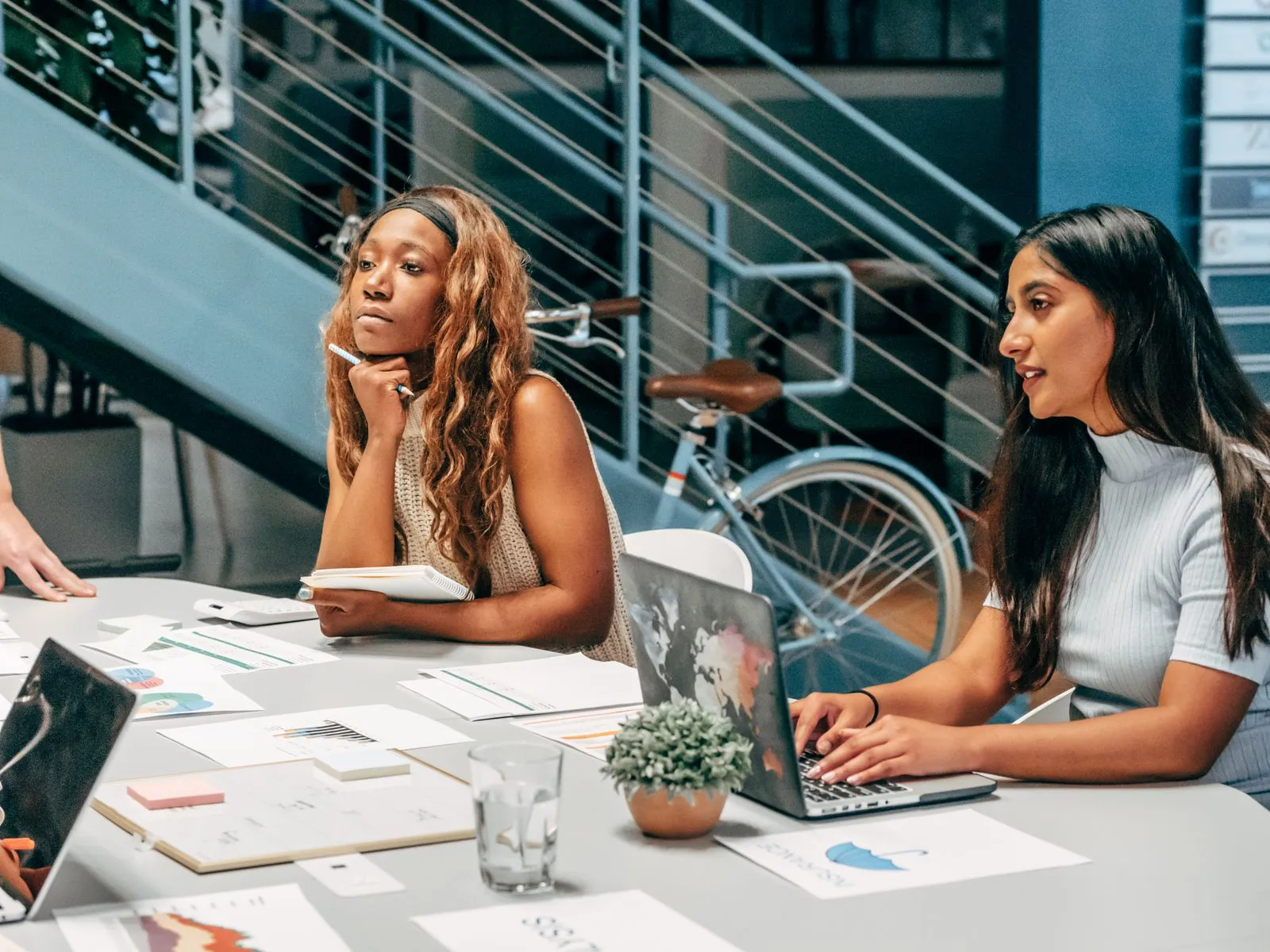 Accounting team reviewing a client's financial documents together at a desk