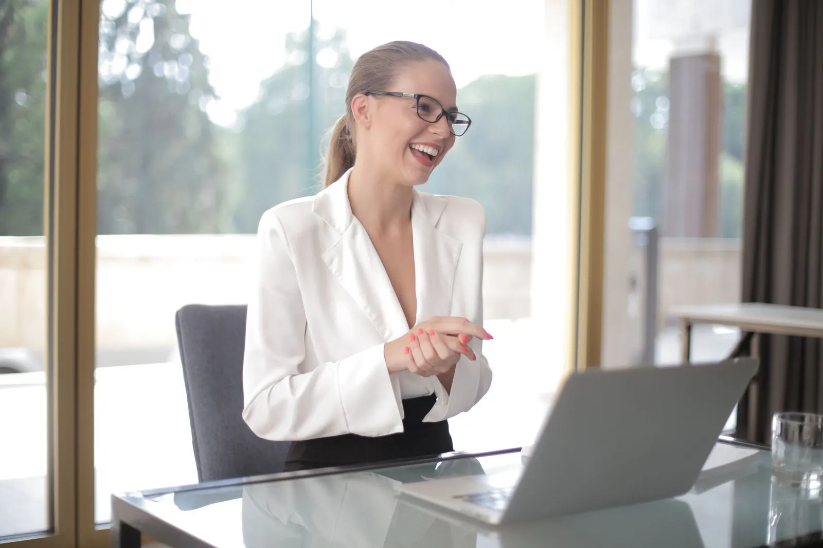 Small business owner working on a laptop in her office