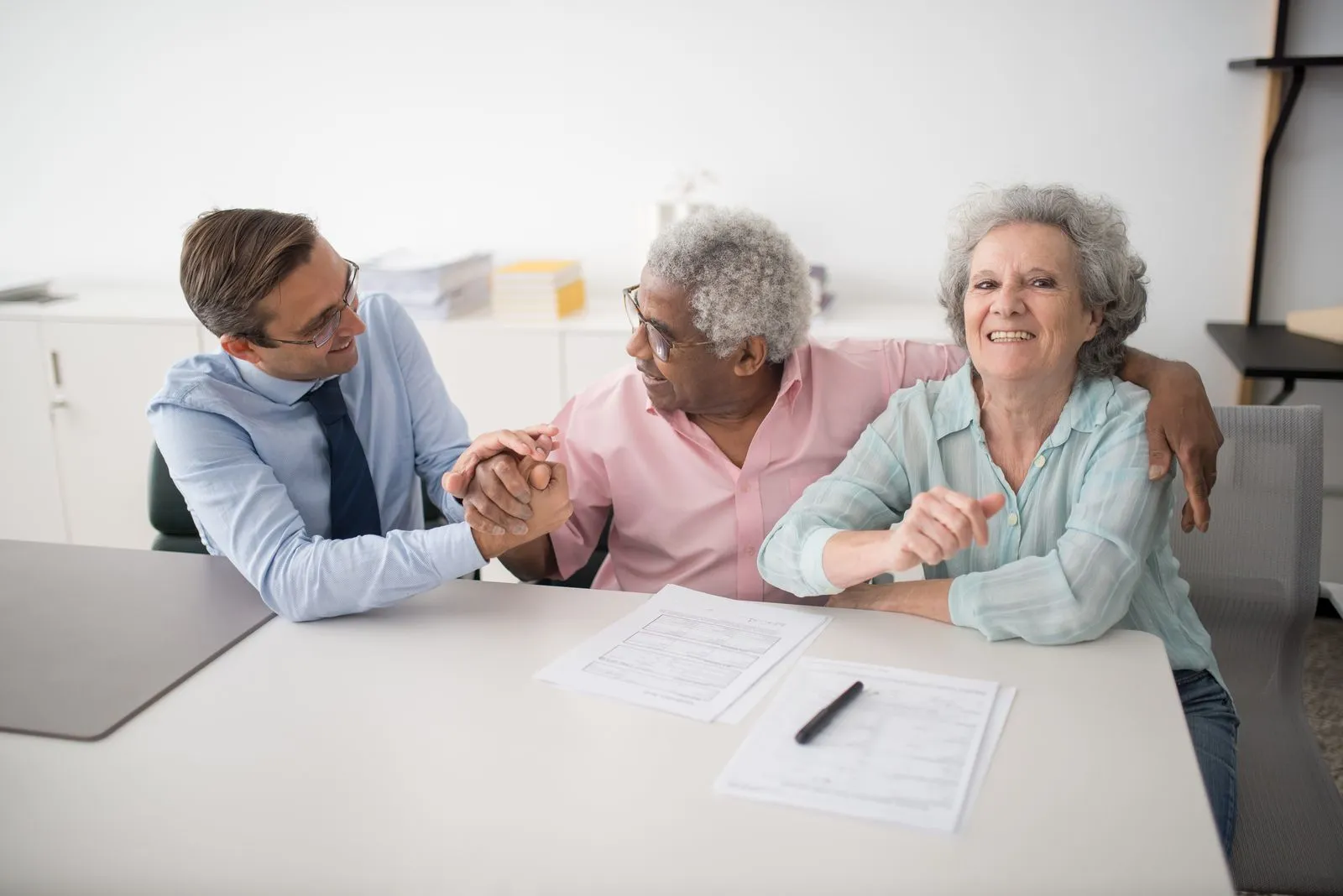A Count myAccount specialist reviewing a tax plan with two clients