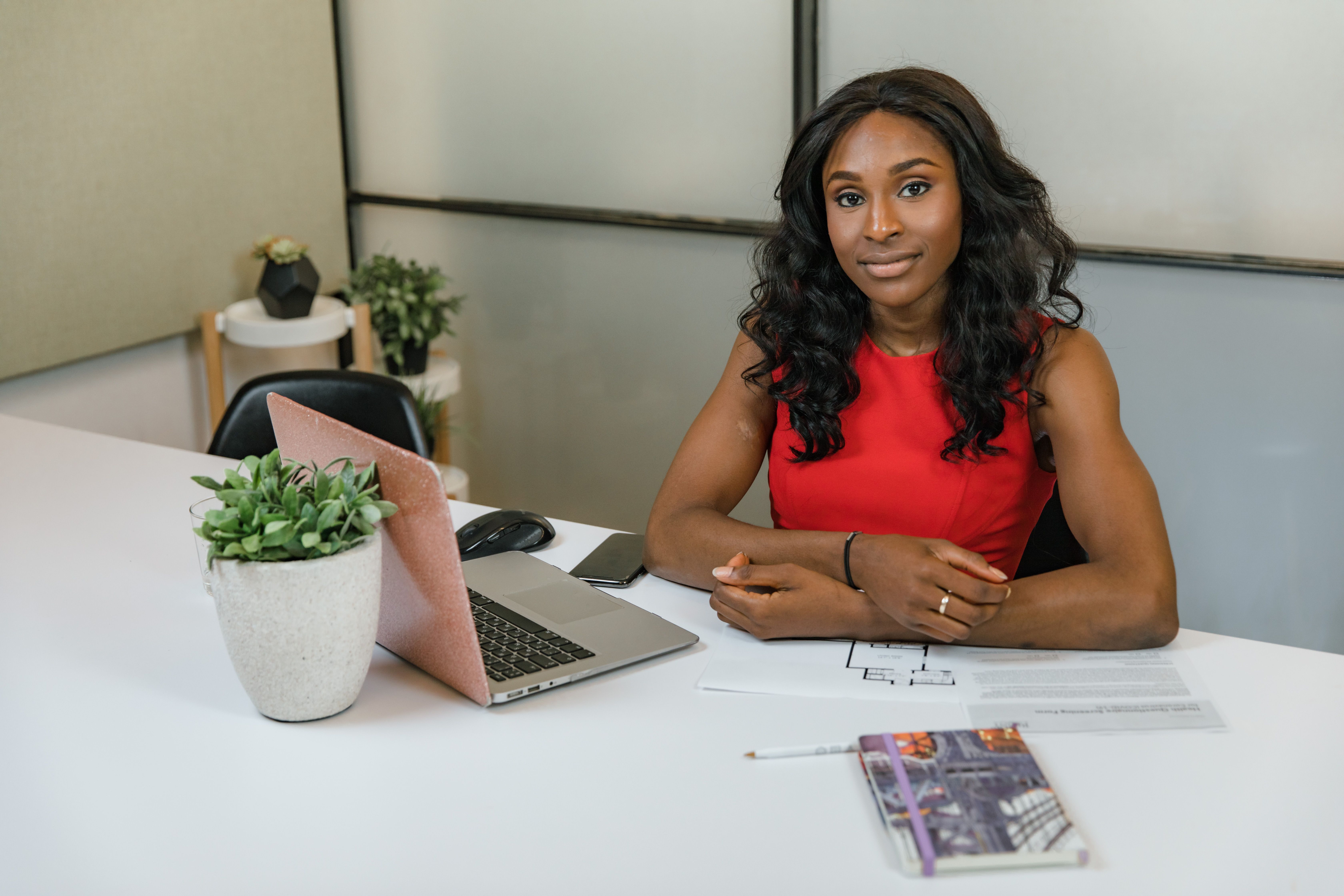Payroll professional reviewing the month's pay run at her desk