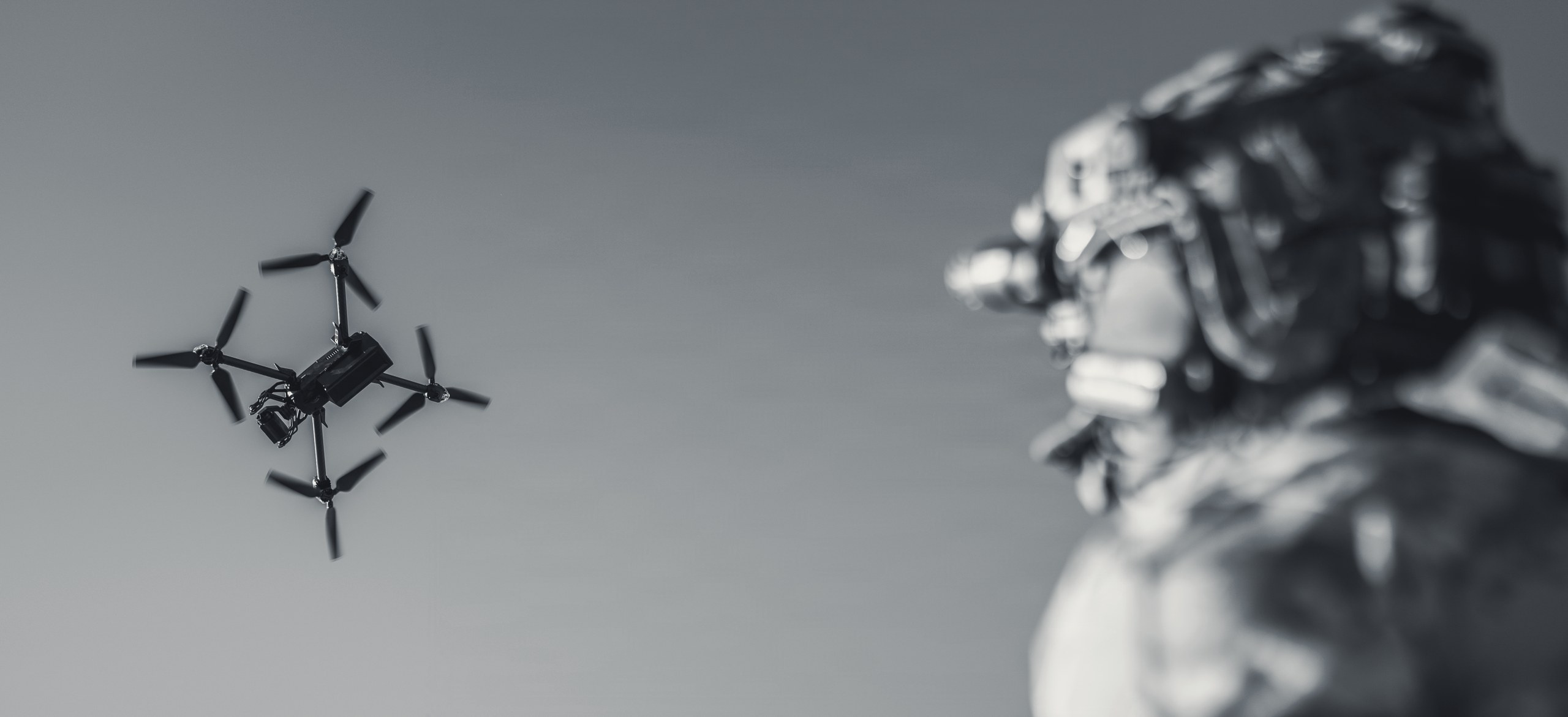 A warfighter watching a drone in flight