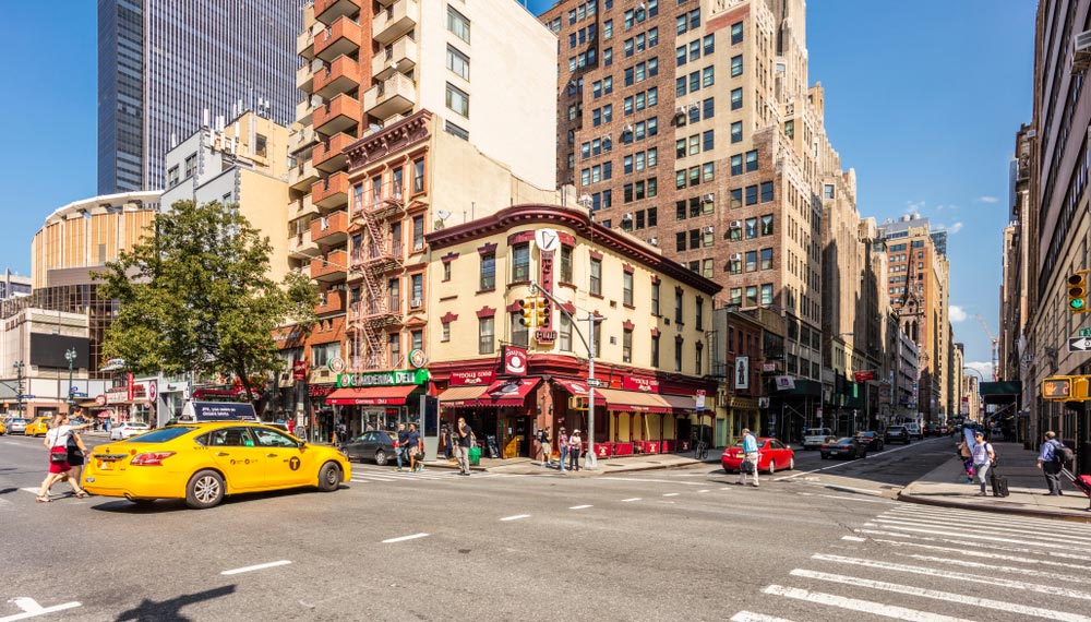 A Midtown West street corner in the afternoon sun