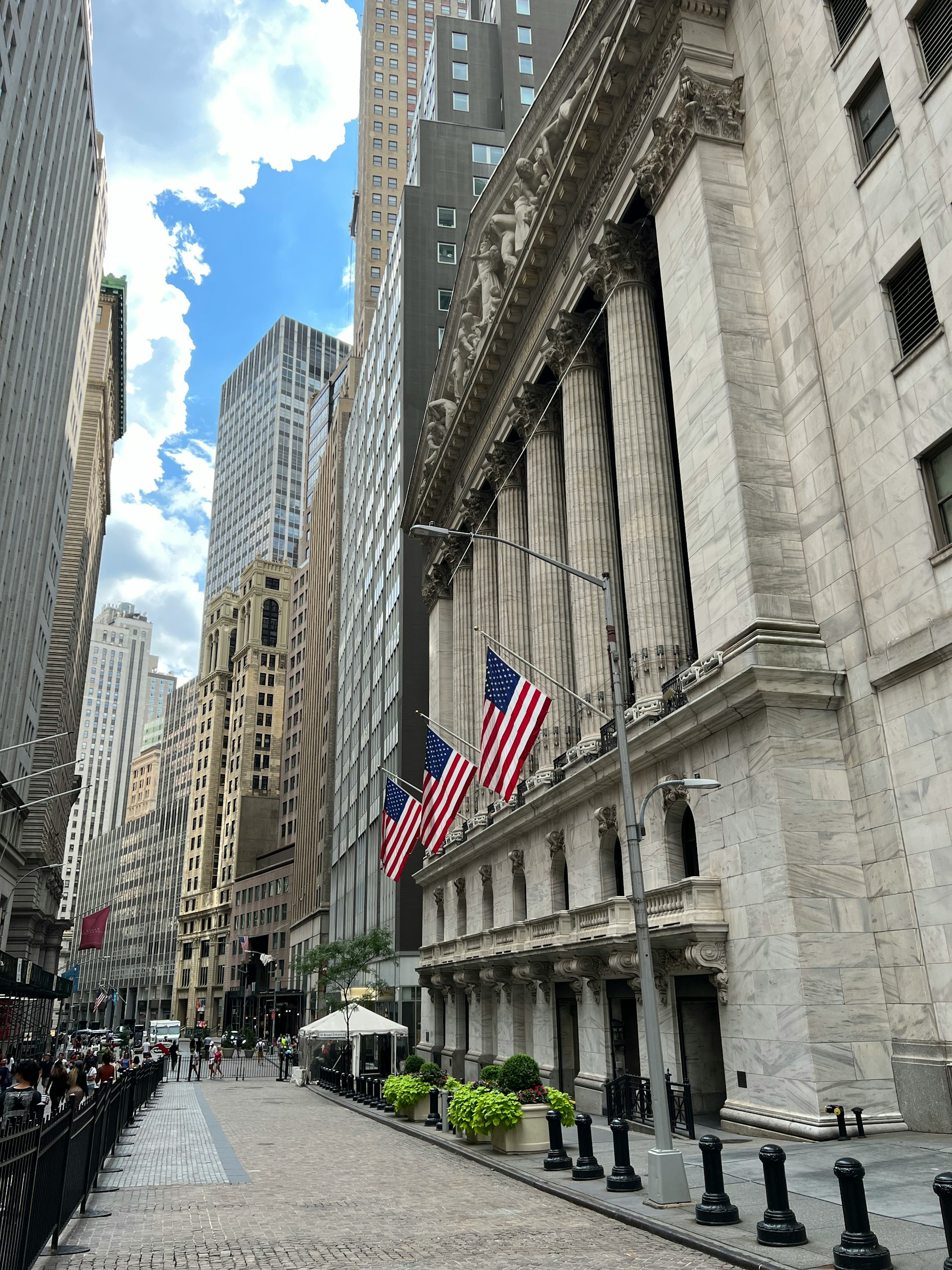 The New York Stock Exchange facade on a quiet Financial District street