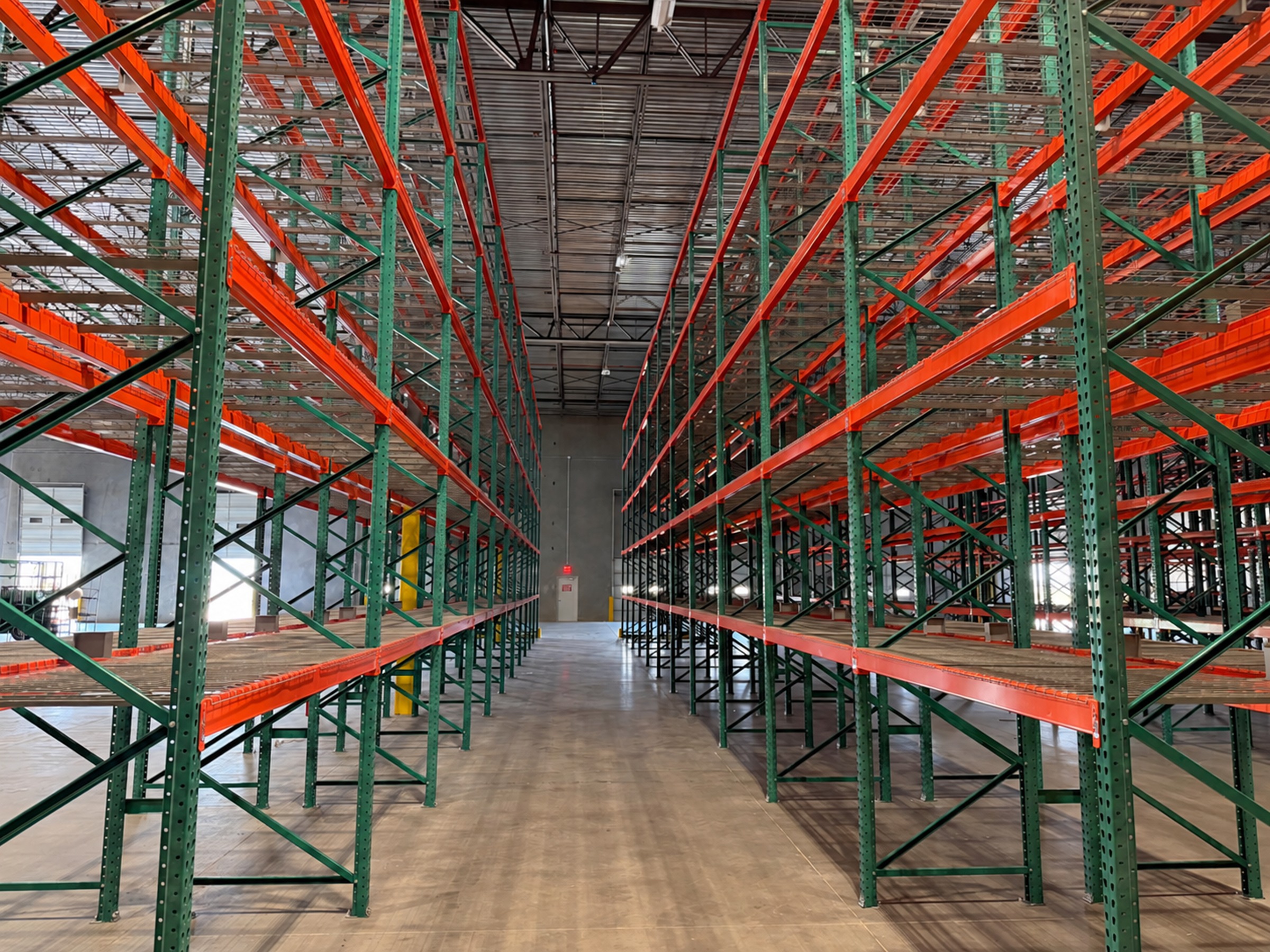 Pallet-rack aisle during the Pallet & Parcel facility buildout