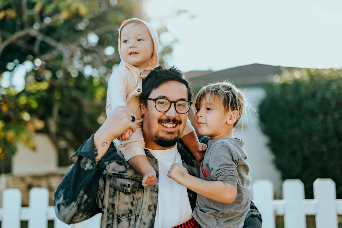 A father and daughter smiling together at home