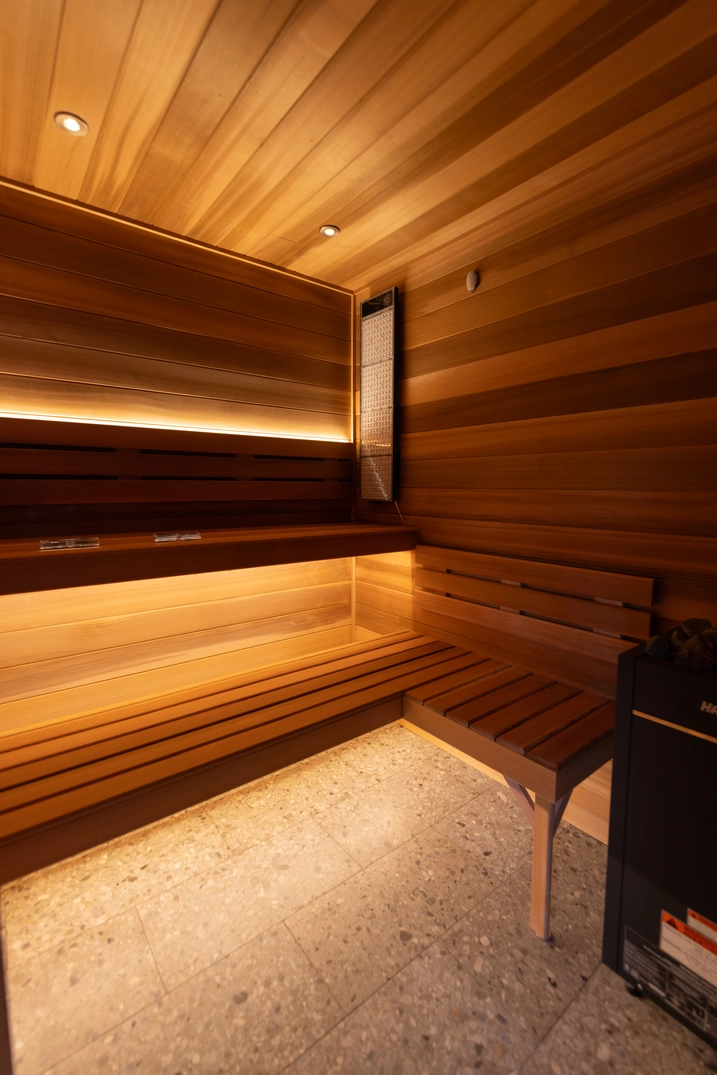 Warm cedar sauna with tiered benches in the Braden Bodell Alpine home