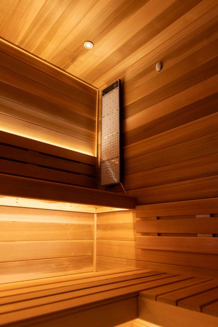 Cedar bench and concealed lighting inside the Braden Bodell sauna