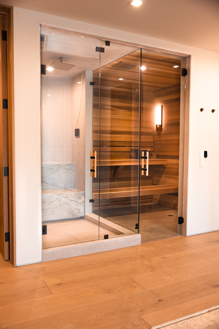 Glass-fronted indoor sauna inside a Deer Valley home