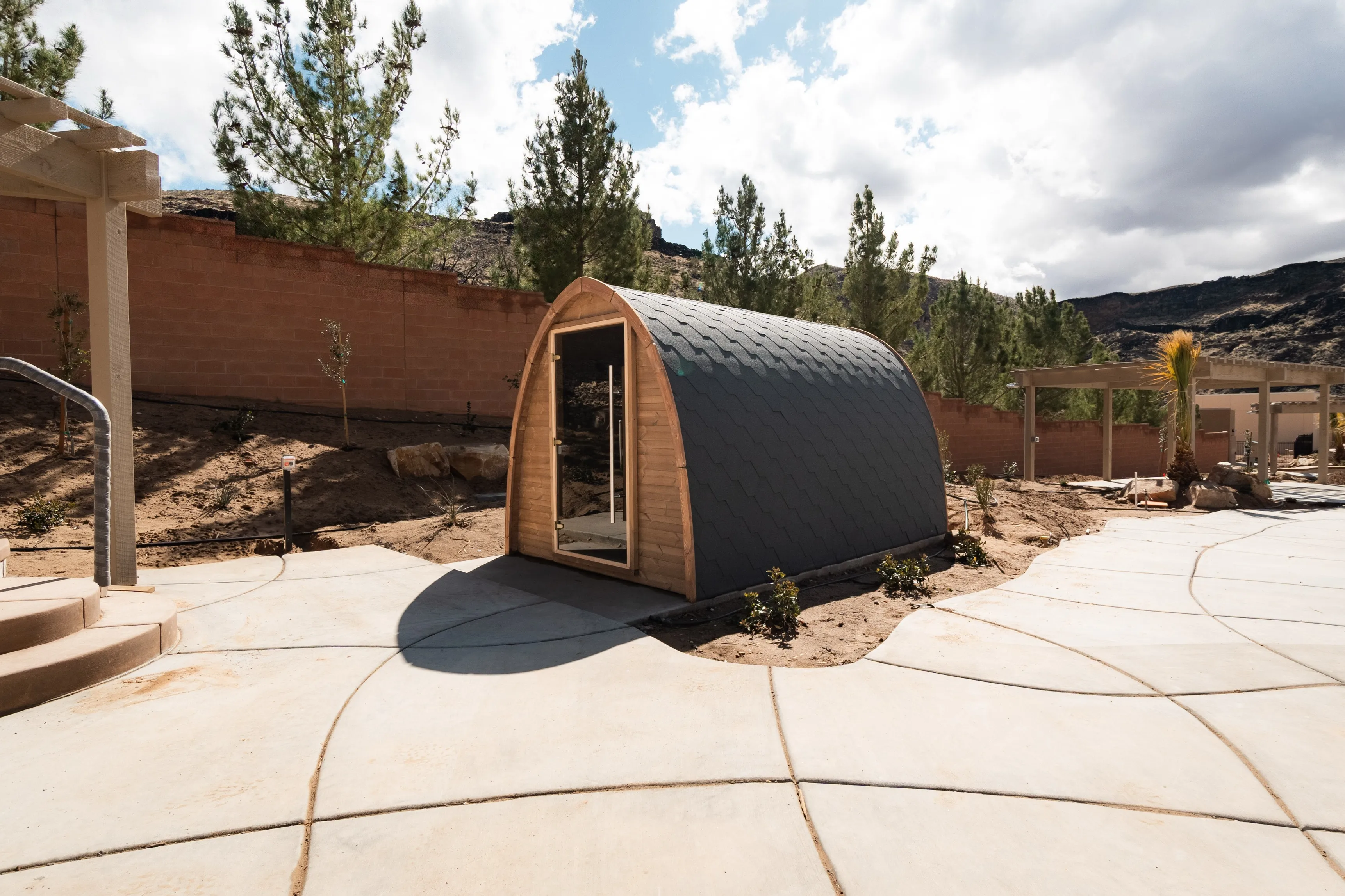 Cedar barrel sauna beside the walking path at Zion Canyon Hot Springs