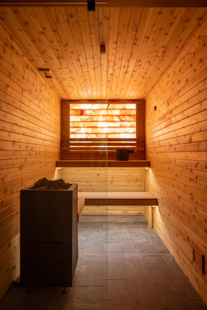 Custom cedar sauna with salt wall at Park City Apartments
