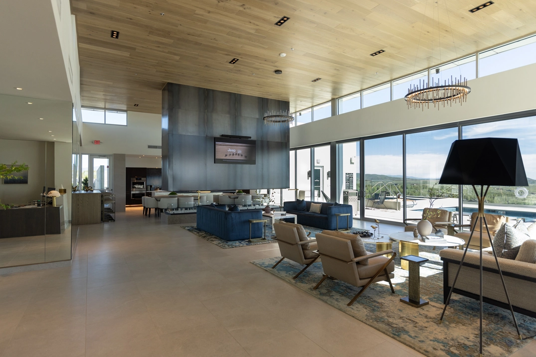 Pinnacle Skyclubhouse lounge with floor-to-ceiling windows and mountain views