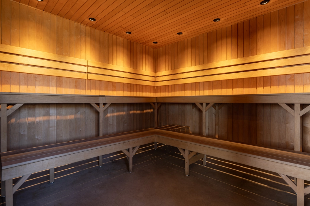 Large cedar sauna with wraparound benches at Plunj Park City