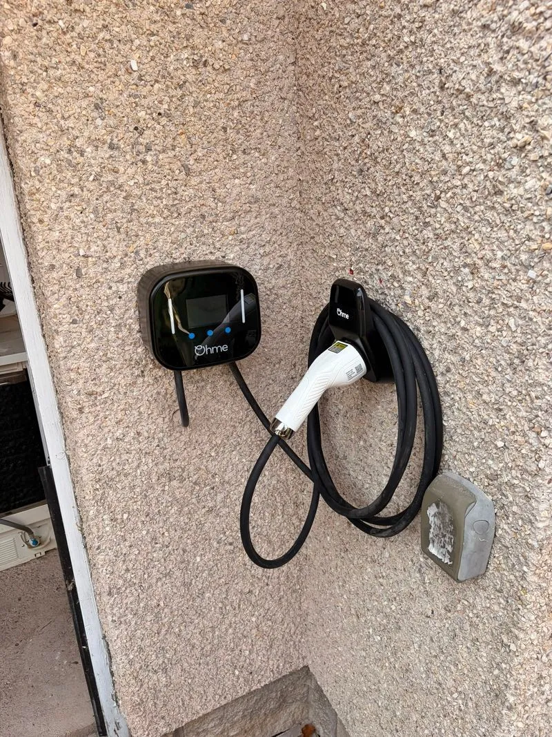 EV charge point installed on an exterior wall