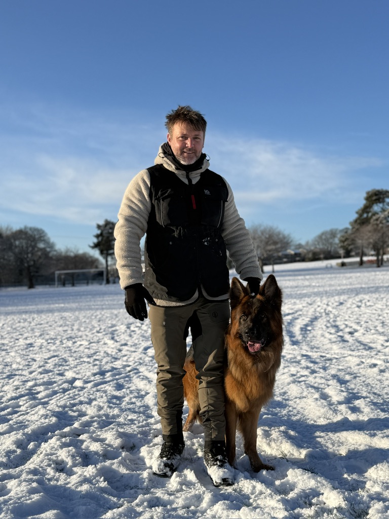Scott McKay with Puro at heel in the snow