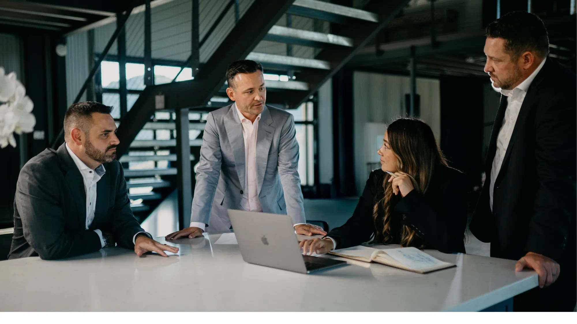 The May Firm legal team meeting with a client