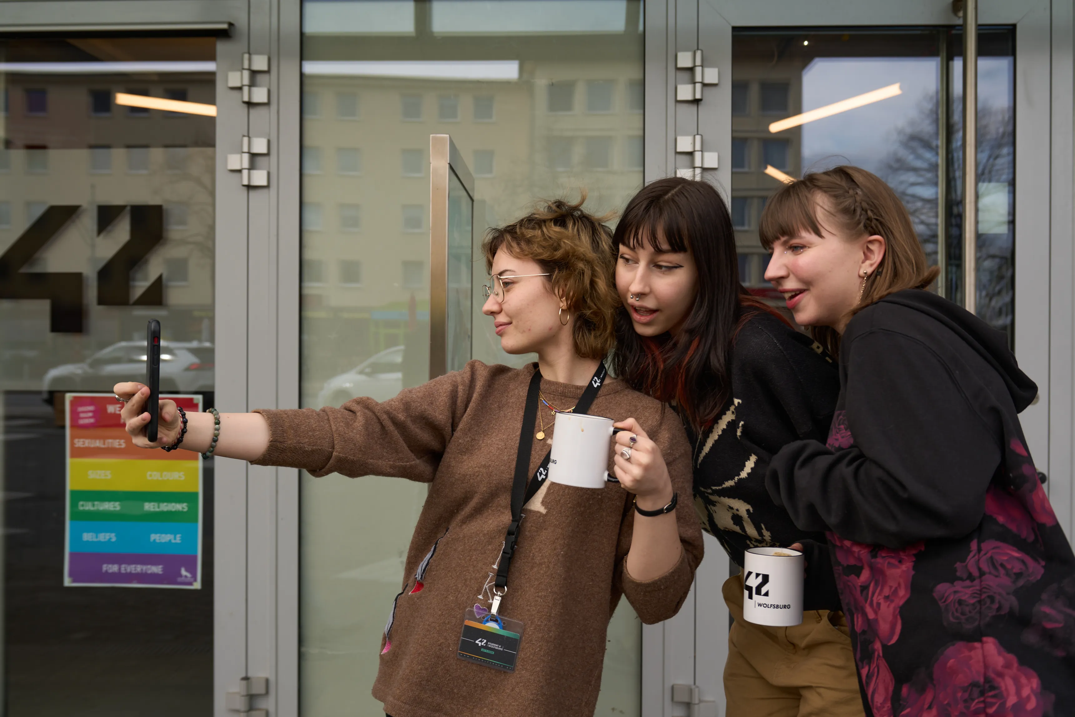 Students taking a selfie at the 42 Wolfsburg entrance