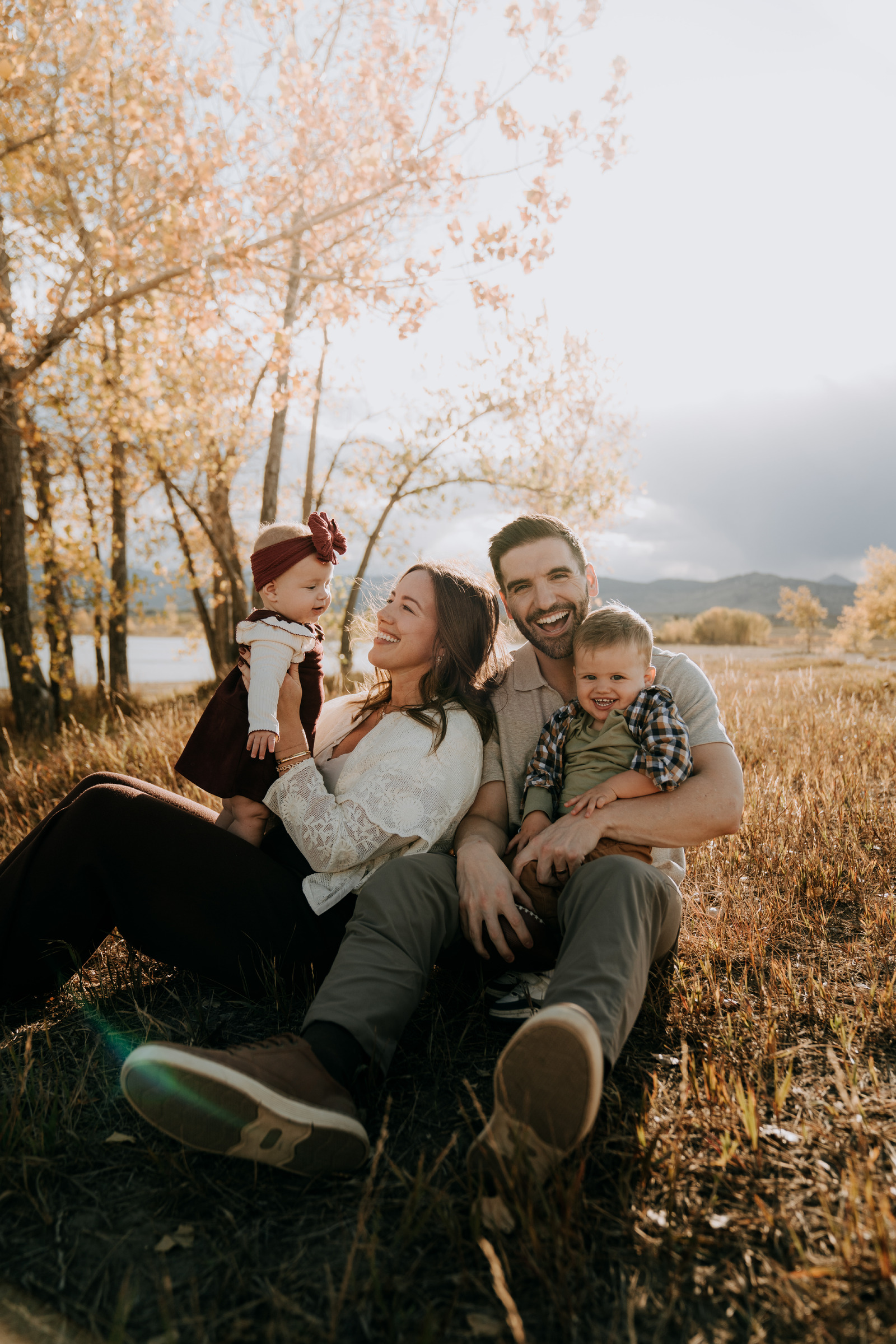 Anna with her husband and two children outdoors in Colorado