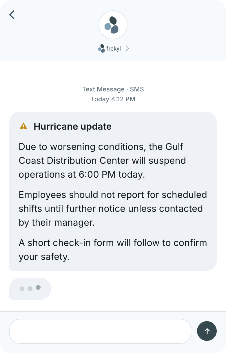 An employee receives the hurricane update by text on their phone