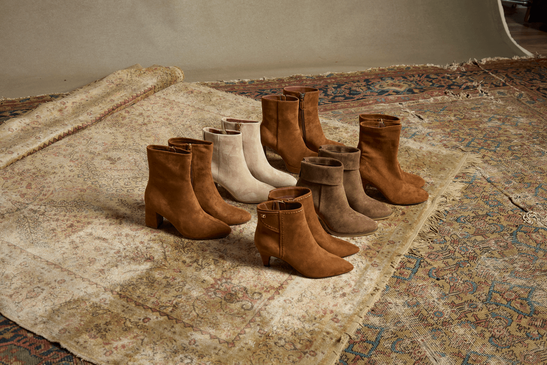 Aerosoles ankle boots in suede neutrals on a vintage rug