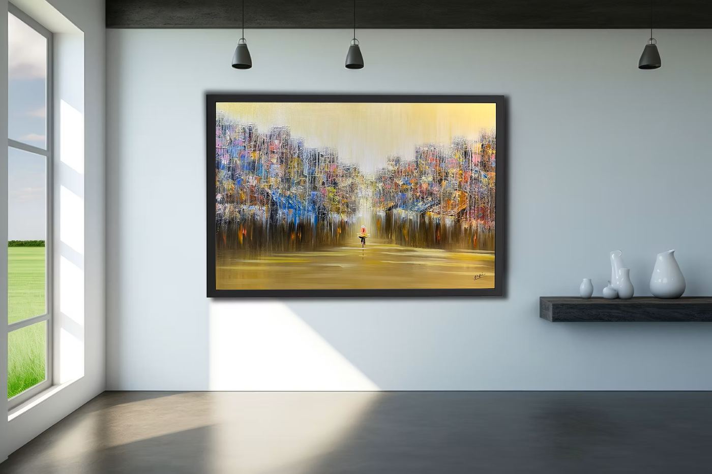 A framed cityscape by Hoa Thái hanging in a sunlit room