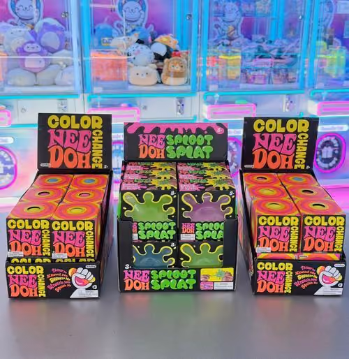 NeeDoh Color Change and Spoot Splat displays in front of the claw machines