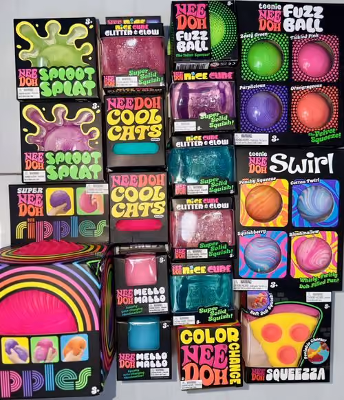A wall of NeeDoh squishies including Cool Cats, Fuzz Ball, Ripples and Spoot Splat