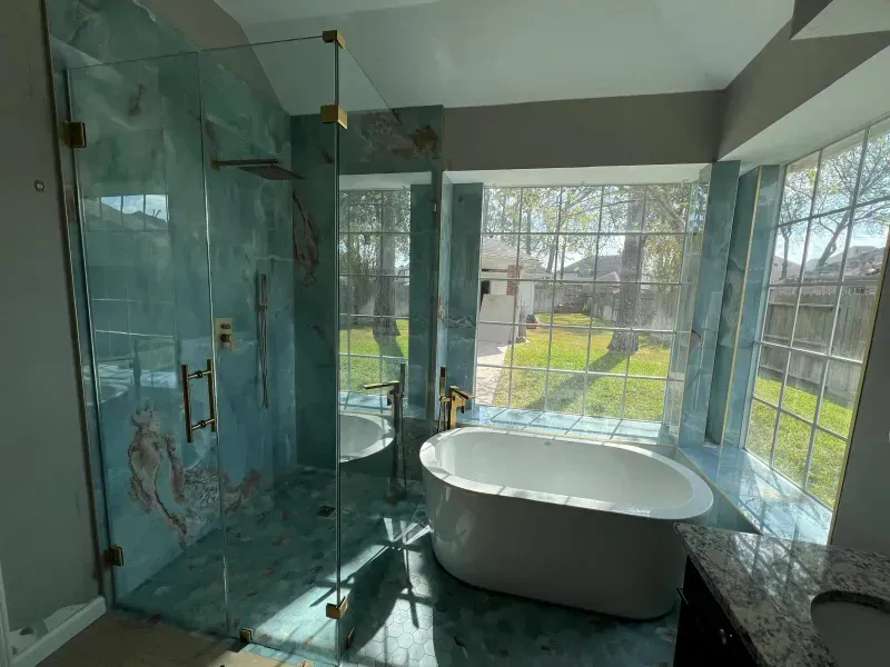 Blue onyx bathroom with freestanding soaking tub