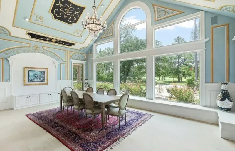 Finished formal dining room with painted ceiling and chandelier
