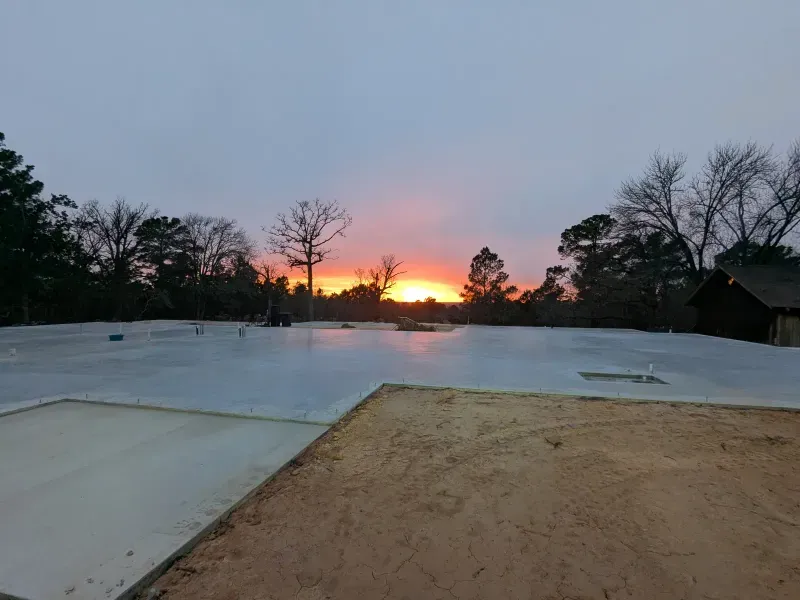 Sunset over completed commercial foundation slab