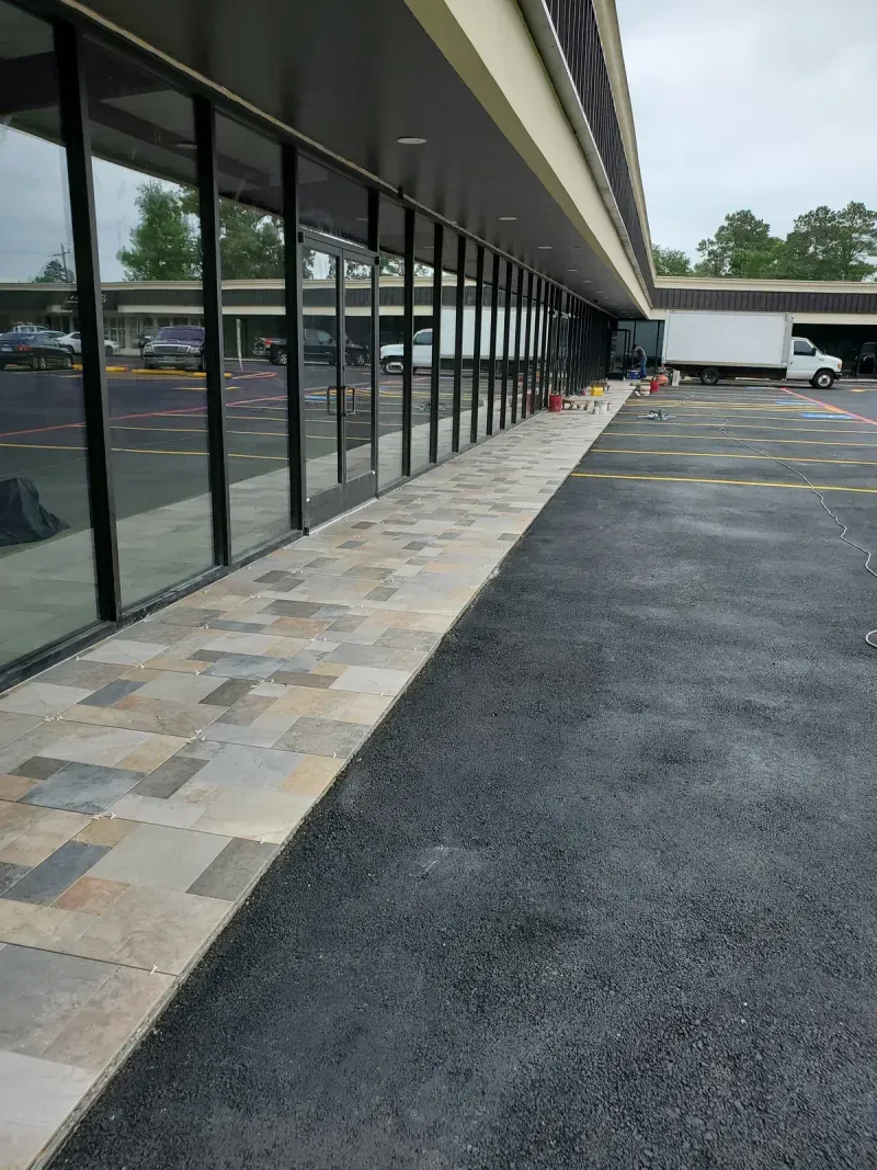Tile walkway installation at commercial storefront entrance