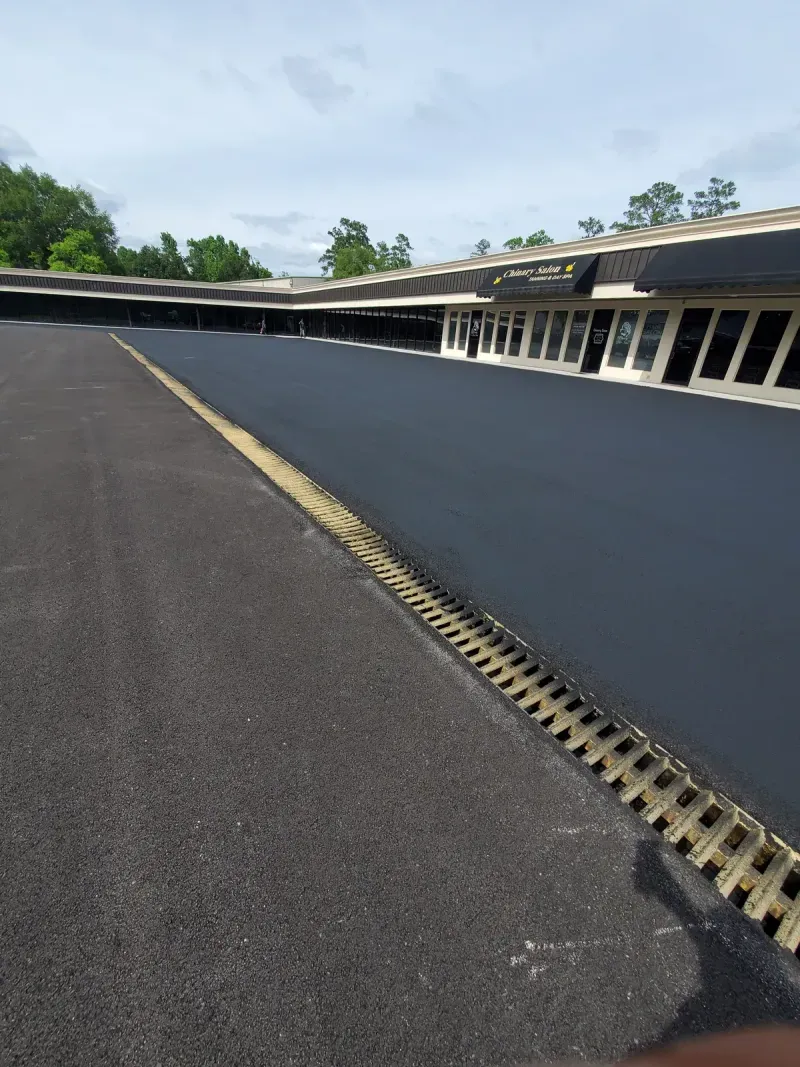 Newly paved parking lot at retail strip center