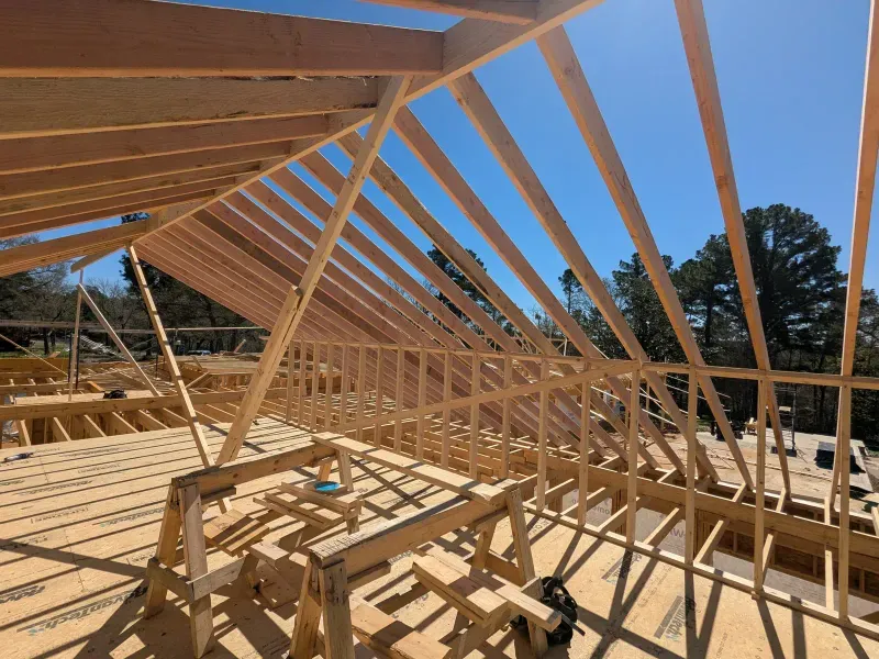 Roof truss framing at custom estate under construction