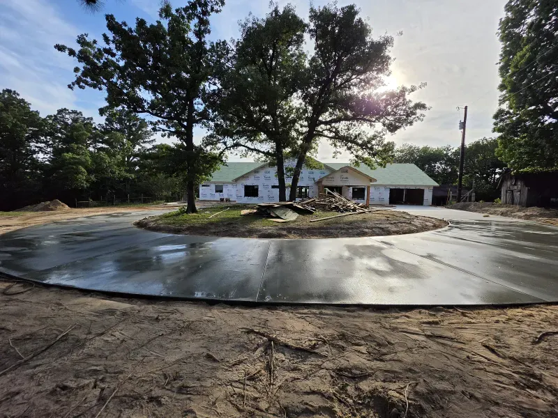 Circular concrete driveway at new estate under construction