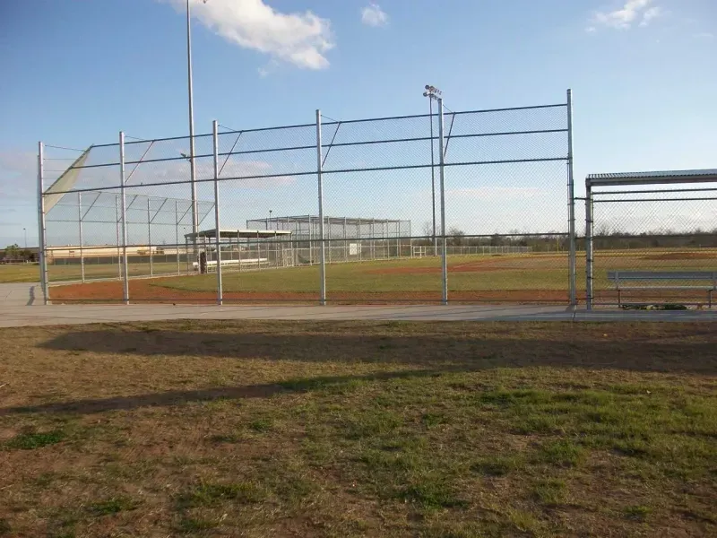 Chain-link fencing installation at baseball field
