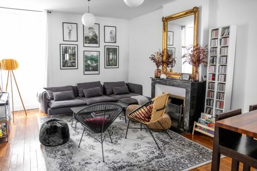 The grey sofa and armchairs around the lounge coffee table