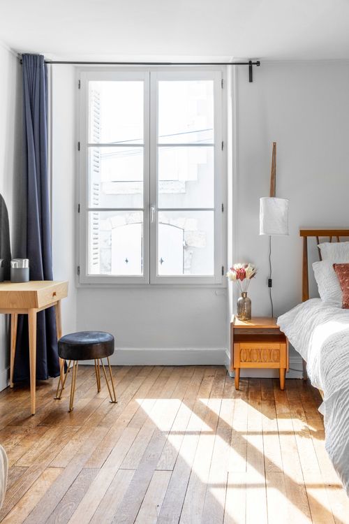 Window light falling on the parquet in the second bedroom