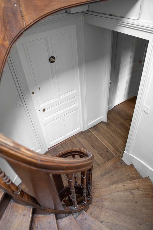 The turning wooden staircase and landing seen from above